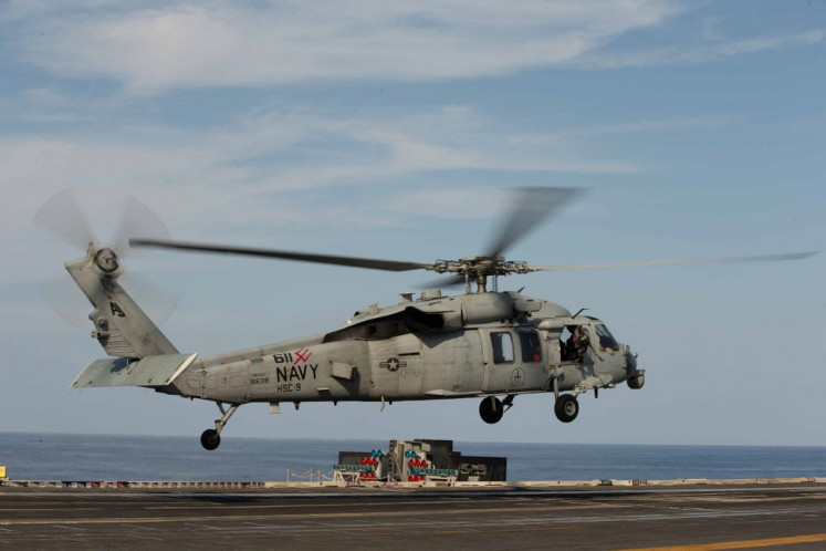 In this image released by the US Department of Defense, an MH-60S Sea Hawk helicopter takes off from the flight deck of the world's largest aircraft carrier USS Gerald R. Ford in the Eastern Mediterranean Sea, October 11, 2023. 