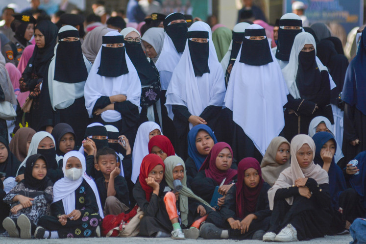 Women students of various pesantren (Islamic boarding schools) across Central Sulawesi participate in an event on Oct. 22 to mark National Santri Day at Alkharaat Islamic boarding school in Palu.