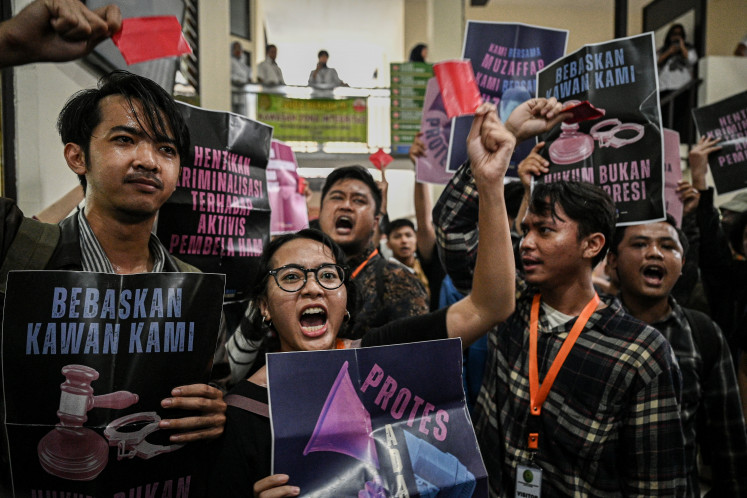 Activists stage a rally at the South Jakarta District Court on Oct. 27, 2025 after the court rejected a pretrial motion filed by fellow activist Delpedro Marhaen, who claimed the police had acted without due process when they named him a suspect for inciting riots during August's nationwide protests.