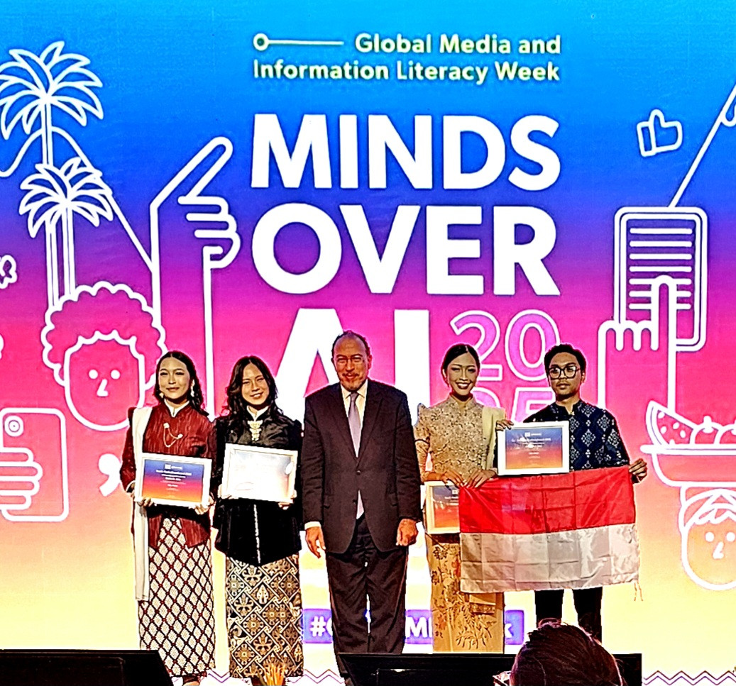 Seen in the picture with Tawfik Jelassi (center), UNESCO's assistant director-general for communication and information, are (left to right): Wynneth Artdelyn Jees, Jesseline Carolee Sabas, Vinnidhiaty Gradelyn Jees and Jonathan Emmanuel Saragih. The team from the Bandung Institute of Technology won a UNESCO Youth Hackathon award on Oct. 25, 2025 for a mobile app designed to help combat misinformation.