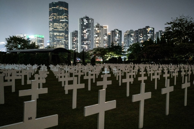 Graves are seen after the commemoration ceremony of the cessation of World War II in Asia at the Menteng Pulo Dutch war cemetery in Jakarta on Aug. 15, 2024. 