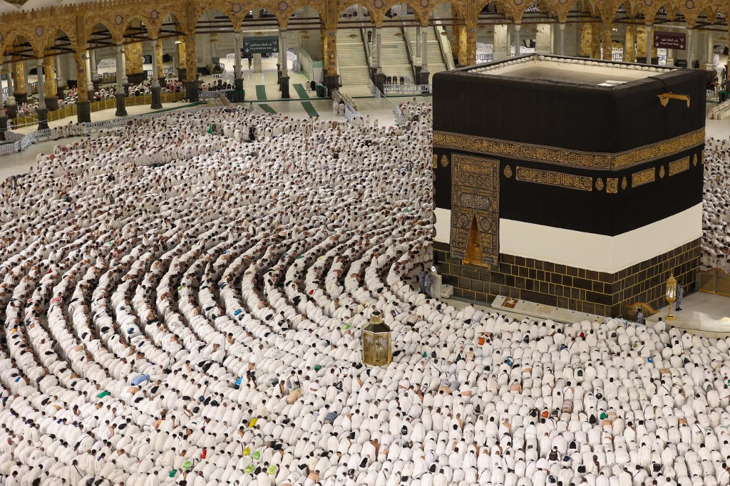 Muslims pray around the Kaaba, Islam's holiest shrine, at the Grand Mosque complex in Mecca, Saudi Arabia, on June 6, 2025.