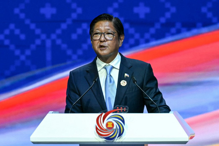 Philippines' President Ferdinand Marcos Jr delivers remarks during the ASEAN chairmanship handing over ceremony as part of the closing ceremony of the 47th Association of Southeast Asian Nations (ASEAN) Summit in Kuala Lumpur on October 28, 2025. 