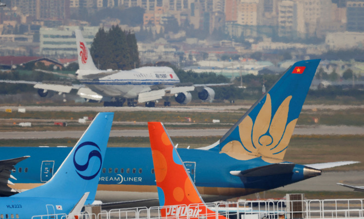 An Air China flight with Chinese President Xi Jinping on board lands at Gimhae International Airport, as he arrives to attend the Asia-Pacific Economic Cooperation (APEC) summit, in Busan, South Korea, on Oct. 30, 2025.