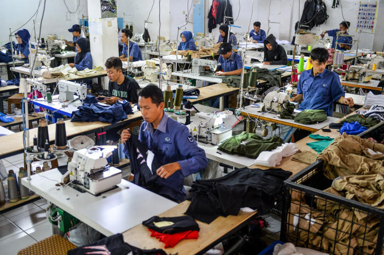 Workers complete production of fashion products Oct. 29, 2025, at the Tectona Textile Factory in Pameungpeuk, Bandung Regency, West Java.