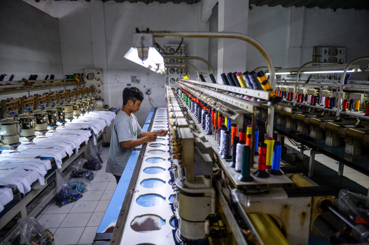 Workers produce garments at the Tectona textile factory in Pameungpeuk, Bandung regency, West Java, on Oct. 29, 2025.