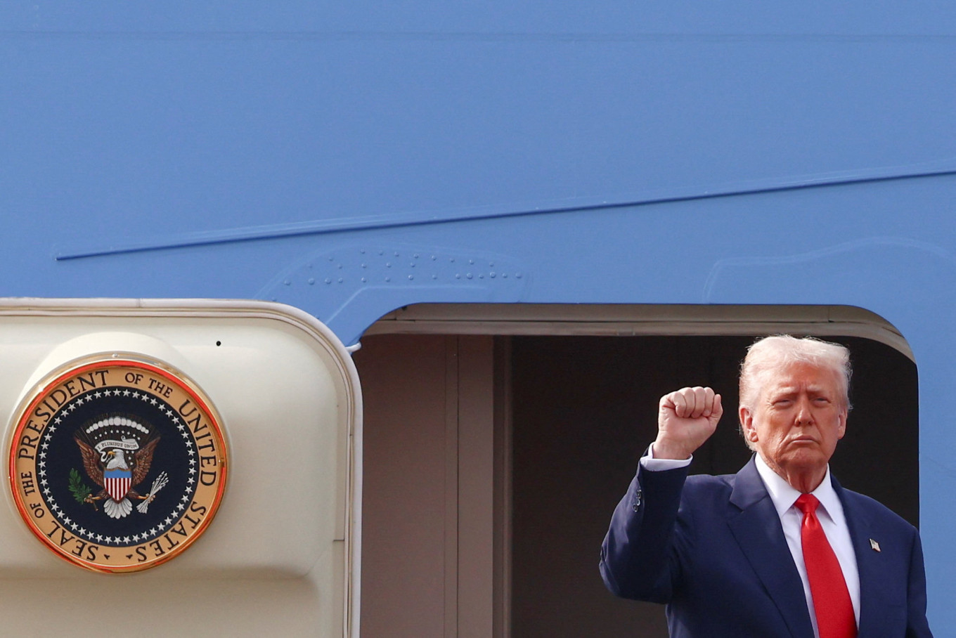 Nuking up: United States President Donald Trump gestures as he boards Air Force One at Gimhae International Airport on Thursday, October 30, 2025, in Busan, South Korea.