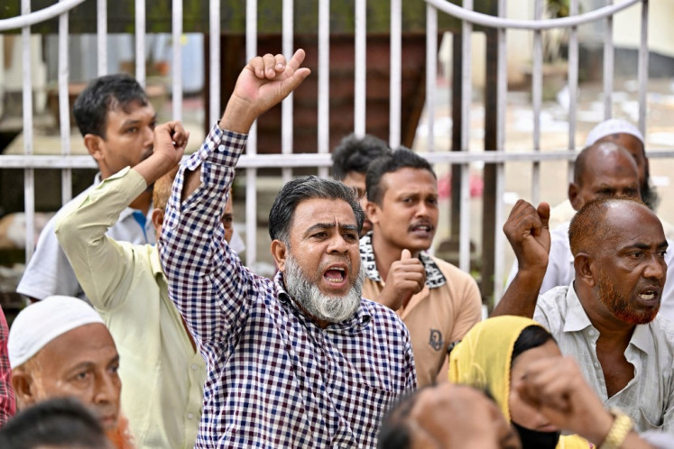Port workers protest during a hunger strike in front of the Chittagong Press Club in Chattogram, Bangladesh, on Nov. 1, 2025. The port workers were protesting the interim Bangladesh government's decision to lease operating licenses at Chattogram (formerly known as Chittagong) Port to a foreign company.