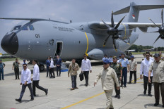 President Prabowo Subianto (front blue cap) takes part in a handover ceremony of one of two Airbus A-400M military transport aircraft to the Indonesian Air Force at Halim Perdanakusuma air base in Jakarta on Nov. 3, 2025.