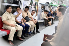 Track record: President Prabowo Subianto (left) rides a commuter train from Manggarai Station on Tuesday, November 04, 2025, on the way to inaugurate the newly built Tanah Abang Baru Station in Central Jakarta, a Rp 309 billion (US$18.47 million) project. 