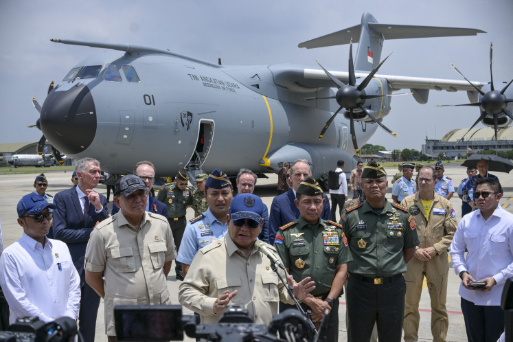 President Prabowo Subianto ('center') speaks to journalists after a handover ceremony on Nov. 3, 2025, of one of two Airbus A400M military transport aircraft to the Air Force at Halim Perdanakusuma Air Base in East Jakarta.