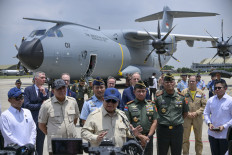 President Prabowo Subianto ('center') speaks to journalists after a handover ceremony on Nov. 3, 2025, of one of two Airbus A400M military transport aircraft to the Air Force at Halim Perdanakusuma Air Base in East Jakarta.
