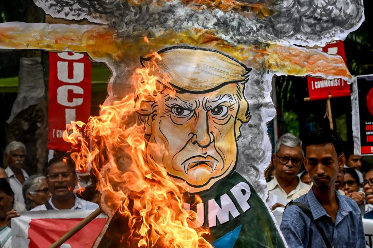Socialist Unity Centre of India (SUCI) activists burn an effigy of United States President Donald Trump during a rally on Aug. 6 in Kolkata, India, to mark the 80th anniversary of the world's first atomic bomb attack, on Hiroshima, Japan, at the end of WWII.