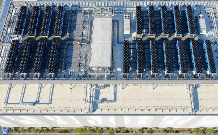 An aerial view of the roof of a 33 megawatt data center with closed-loop cooling system on October 20, 2025 in Vernon, California. A surge in demand for AI infrastructure is fueling a boom in data centers across the country and around the globe.
