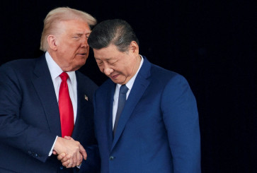 US President Donald Trump and Chinese President Xi Jinping talk as they leave after a bilateral meeting at Gimhae International Airport, on the sidelines of the Asia-Pacific Economic Cooperation (APEC) summit, in Busan, South Korea on October 30, 2025. 