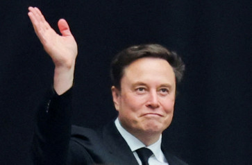 Top earner: Tesla CEO Elon Musk attends a memorial service for slain conservative commentator Charlie Kirk at State Farm Stadium, in Glendale, Arizona, US, on Sept. 21, 2025.