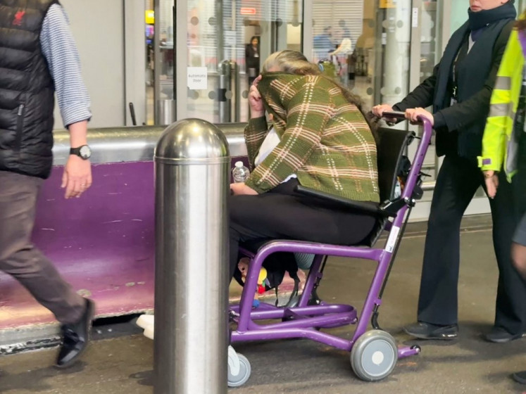 Lindsay Sandiford is wheeled in a wheelchair to waiting transport after landing at Terminal 4 of London Heathrow airport on Nov. 7, 2025, as part of a repatriation agreement between Indonesia and the United Kingdom. Two British drug convicts including grandmother Lindsay Sandiford, who was on death row, flew home early on Nov. 7, as part of a deal to return them on humanitarian grounds.