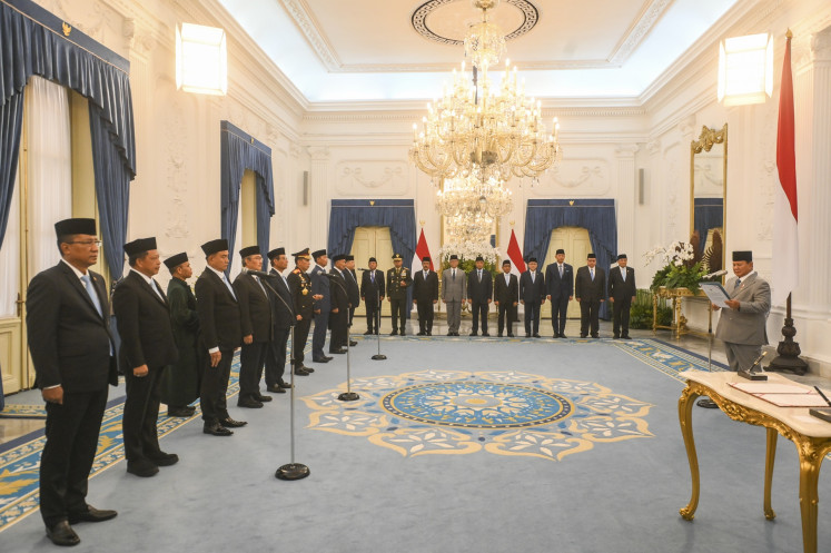 President Prabowo Subianto ('right') swears in members of the Police Reform Acceleration Committee on Friday, at the Merdeka Palace in Central Jakarta. The committee has been tasked to advise the President on potential measures to be taken to push for comprehensive reform of the National Police, following growing public pressure for change.