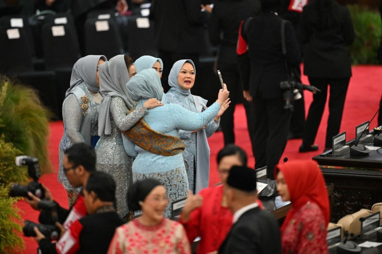 Female lawmakers of the House of Representatives pose for a photo before the start of the inauguration ceremony of President Prabowo Subianto on Oct. 20, 2024, at the Senayan legislative complex in Central Jakarta. 