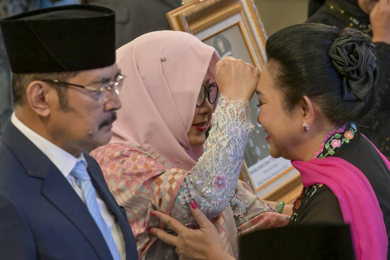 Children of former President Suharto Bambang Trihatmodjo (left), Siti Hardijanti Rukmana (center), and Siti Hediati Hariyadi (right), who is also the former wife of Indonesia's President Prabowo Subianto, attend a ceremony held to mark the National Heroes Day at the State Palace in Jakarta on Nov. 10, 2025. Indonesia added former president Suharto to a list of national heroes during a ceremony on Nov. 10, despite objections from activists and academics over the deceased military dictator's human rights record. 
