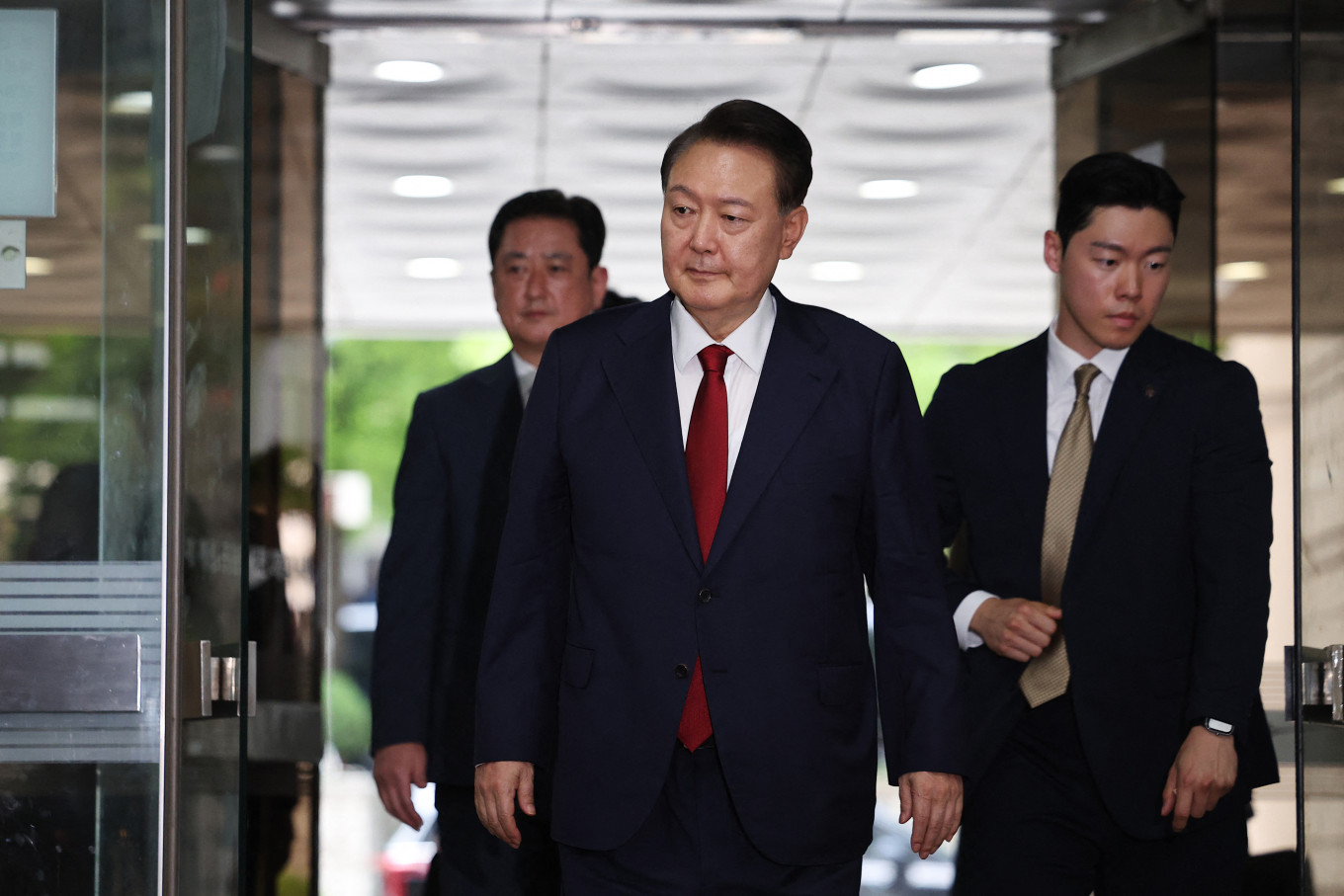 Disgraced executive: South Korea&rsquo;s former impeached president Yoon Suk-yeol (center) arrives at a court on July 9, 2025 in Seoul to attend a hearing to review his arrest warrant requested by special prosecutors.