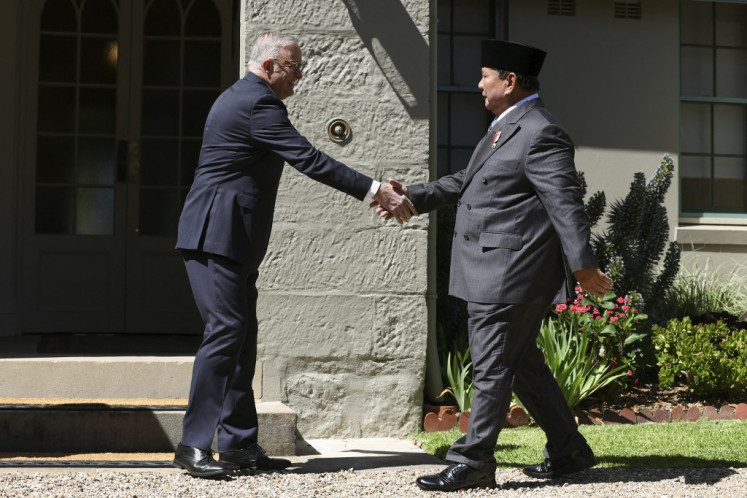 Australia's Prime Minister Anthony Albanese (left) welcomes President Prabowo Subianto at Kirribilli House in Sydney on November 12, 2025.