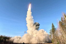 Strike capabilities: A screengrab from footage released on Oct. 22 shows the launch of a Yars intercontinental ballistic missile at the Plesetsk testing field in northern Russia during drills by the country&rsquo;s nuclear forces.