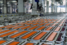 An automated lithium-ion battery production line operates at a workshop of Zhejiang Shineway Technology Co Ltd in Yongkang, Zhejiang province, China, on Nov. 11, 2025.