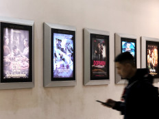 View of the 'Now Showing’ movie list as seen in front of Cinema XXI inside a shopping mall on Jl. Basuki Rachmat, East Jakarta, on Thursday.