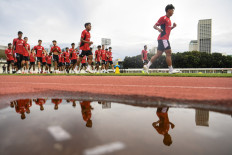 Players of Indonesia's under-22 (U-22) men's national soccer team warm up during a training session at the Madya Stadium of Gelora Bung Karno (GBK) sports complex in Jakarta on Nov. 11, 2025. The team will compete in the 2025 Southeast Asian Games (SEA Games) in Thailand from Dec. 9 to 20.