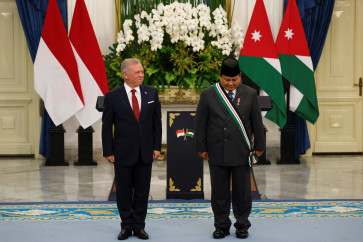 Jordan's King Abdullah II ibn Al Hussein looks at Indonesian President Prabowo Subianto after bestowing the Bejeweled Grand Cordon of Al Nahda on Indonesian President Prabowo Subianto at the Merdeka Palace in Jakarta, November 14, 2025. (Reuters/Ajeng Dinar Ulfiana).
Usage: 0