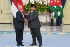 President Prabowo Subianto (right) greets King Abdullah II of Jordan during a state visit on Nov. 14, 2025, at the State Palace in Central Jakarta.