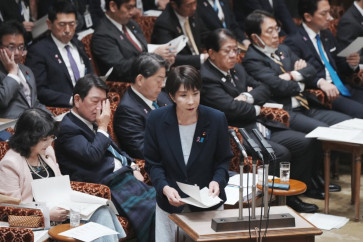 Japan's Prime Minister Sanae Takaichi (center) attends a session of the House of Councillors Budget Committee at the National Diet in Tokyo, Japan on Nov. 14, 2025.