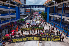 Activists hold a huge banner reading “Our future is not for sale“ during the so-called “Great People's March“ in the sidelines of the COP30 UN Climate Change Conference in Belém, Para State, Brazil on Nov. 15, 2025. Thousands of people attended the march to demand “real solutions“ to human-caused global warming , and which comes at the halfway point of contentious COP30 negotiations following two Indigenous-led protests that disrupted proceedings earlier in the week.