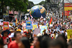 Thousands of people take part in the Great People's March in Belém on Nov. 15, 2025, to deliver a rallying call for climate action and justice as world leaders attend the 30th United Nations Climate Change Conference (COP30) in Brazil.