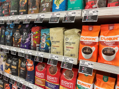 Coffee packages with their price tags are displayed on a shelf at a supermarket in Union City, New Jersey, US, on Oct. 15, 2025.