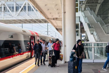 Passengers disembark from a Whoosh high-speed train at Padalarang Station in Bandung, West Java, on Oct. 17, 2025. 