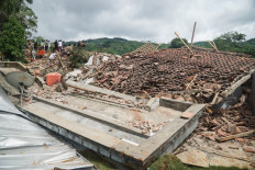 A destroyed house is seen as rescuers search for survivors after a landslide buried some houses in Cibeunying village, Cilacap regency, Central Java, on November 14, 2025. 