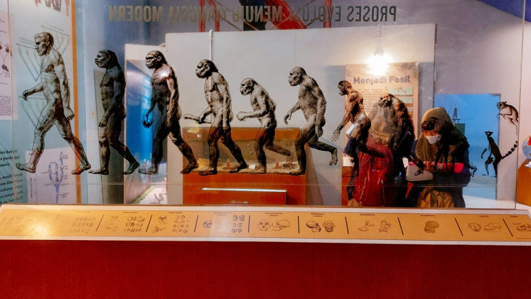 Visitors look at an exhibition on the evolution of ancient humans at the Sangiran Museum in Sragen, Central Java, on Feb. 4, 2025.