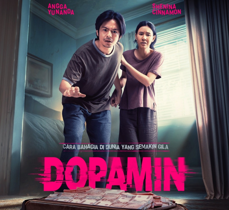 Money madness: Actors Angga Yunanda (left) and Shenina Cinnamon appear in a promotional image for 'Dopamin’, director Teddy Soeria Atmadja’s latest offering that blends romance, drama and survival.