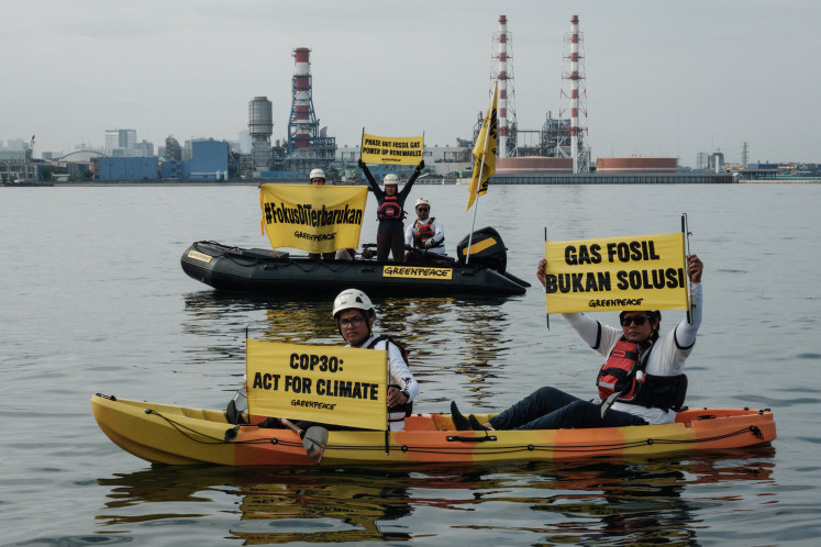 Greenpeace Indonesia activists protest on Nov. 18, 2025, in front of the Muara Karang gas-fired power plant in North Jakarta. The protest had been against the inconsistency of national energy policies, calling for an end to dependence on fossil fuels ahead of the COP30 United Nations Climate Change Conference in Bel&eacute;m, Brazil.