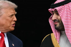 US President Donald Trump (left) greets Crown Prince and Prime Minister of the Kingdom of Saudi Arabia Mohammed bin Salman on the South Lawn at the White House in Washington, DC on November 18, 2025. Saudi Crown Prince Mohammed bin Salman arrived at the White House to fanfare and a jet flyover Tuesday, in his first visit to the United States since the 2018 murder of journalist Jamal Khashoggi.