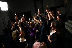  People react to the Senate's passing of the bill to force the release of files related to the late convicted sex offender Jeffrey Epstein, on Capitol Hill in Washington, D.C., US, November 18, 2025.