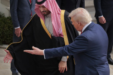 US President Donald Trump (right) welcomes Crown Prince and Prime Minister Muhammad bin Salman of Saudi Arabia during an arrival ceremony at the White House on November 18, 2025 in Washington, DC. 