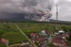An aerial picture shows a pyroclastic flow during the eruption of Mount Semeru in Lumajang, East Java, on November 19, 2025. 