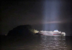 A South Korean ferry carrying about 260 passengers is stranded near a rocky island in the sea off Shinan, South Korea, on Nov. 19, 2025. 