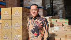 Antonius Auwyang, managing director at Sony Trading Pty Ltd, stands on Nov. 17 in front of his warehouse in Sydney, Australia.