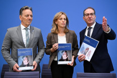 (From right to left) German Interior Minister Alexander Dobrindt; Minister for Education, Family, Senior Citizens, Women and Youth Karin Prien; and President of the German Criminal Police Office (BKA) Holger Muench present the reports “Domestic Violence for 2024“ and “Gender-specific crimes against women for 2024“ during a press conference in Berlin, Germany, on Nov. 21, 2025.