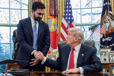 United States President Donald Trump (right) and New York City Mayor-elect Zohran Mamdani shake hands as they meet in the Oval Office at the White House in Washington, D.C., on Nov. 21, 2025.