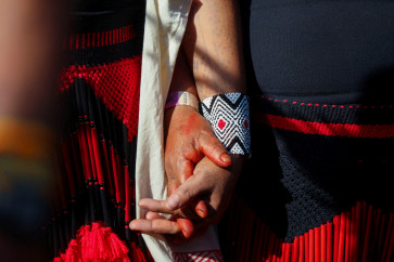 Indigenous people hold hands during a protest to call for climate justice and territorial protection during the UN Climate Change Conference (COP30), in Belem, Brazil, November 17, 2025. 